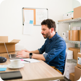 good-looking-man-typing-laptop-posting-his-online-shop-new-products-his-business-startup